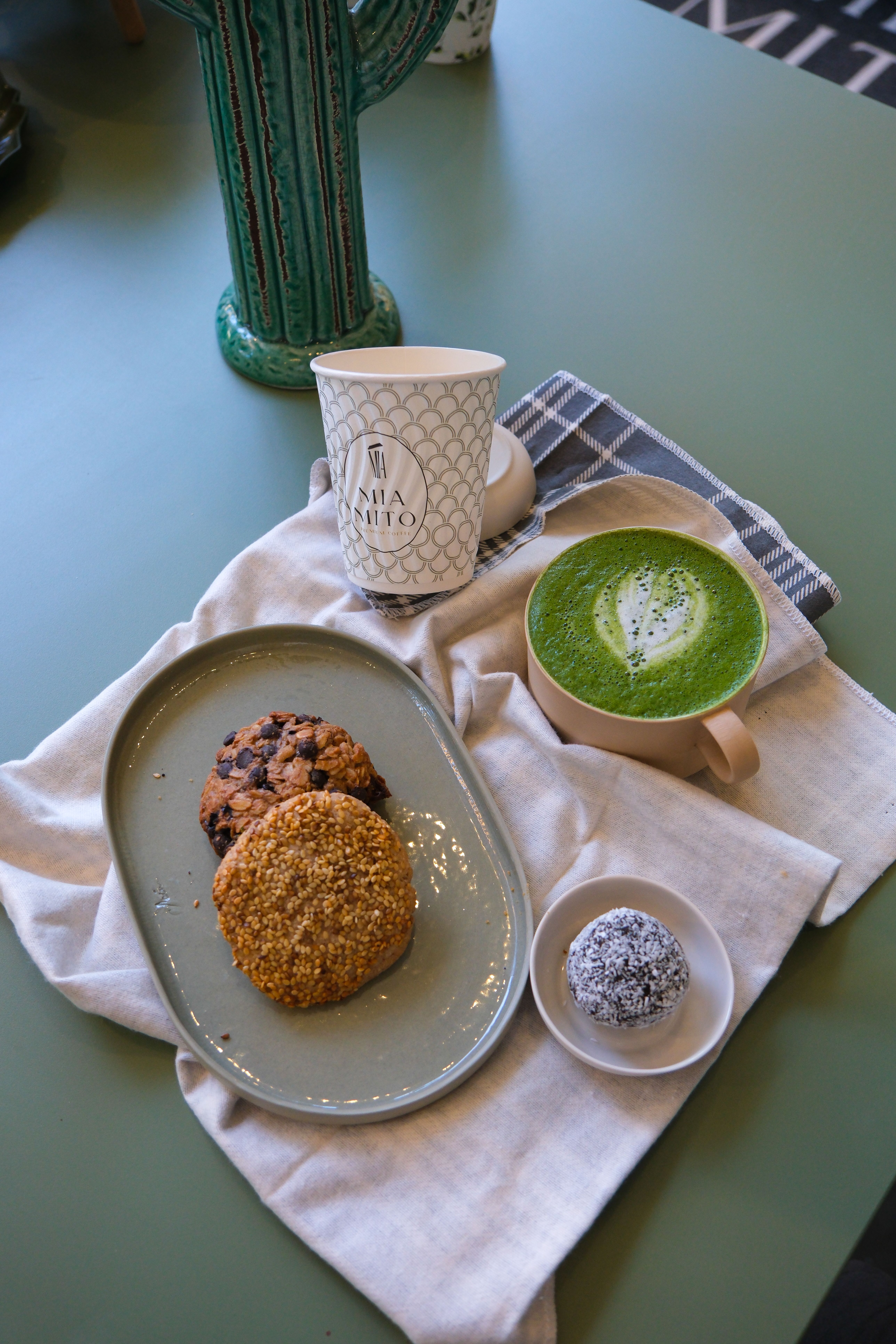 Delicious Matcha Latte and Assorted Cookies Display · Free Stock Photo
