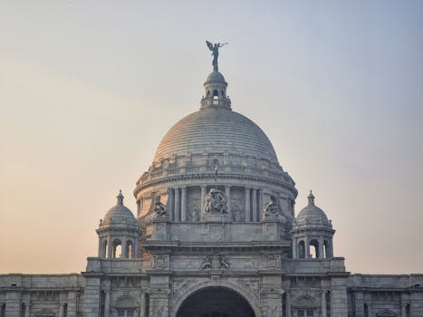 Stunning view of Victoria Memorial, Kolkata, India during sunrise, showcasing its architectural beauty.
