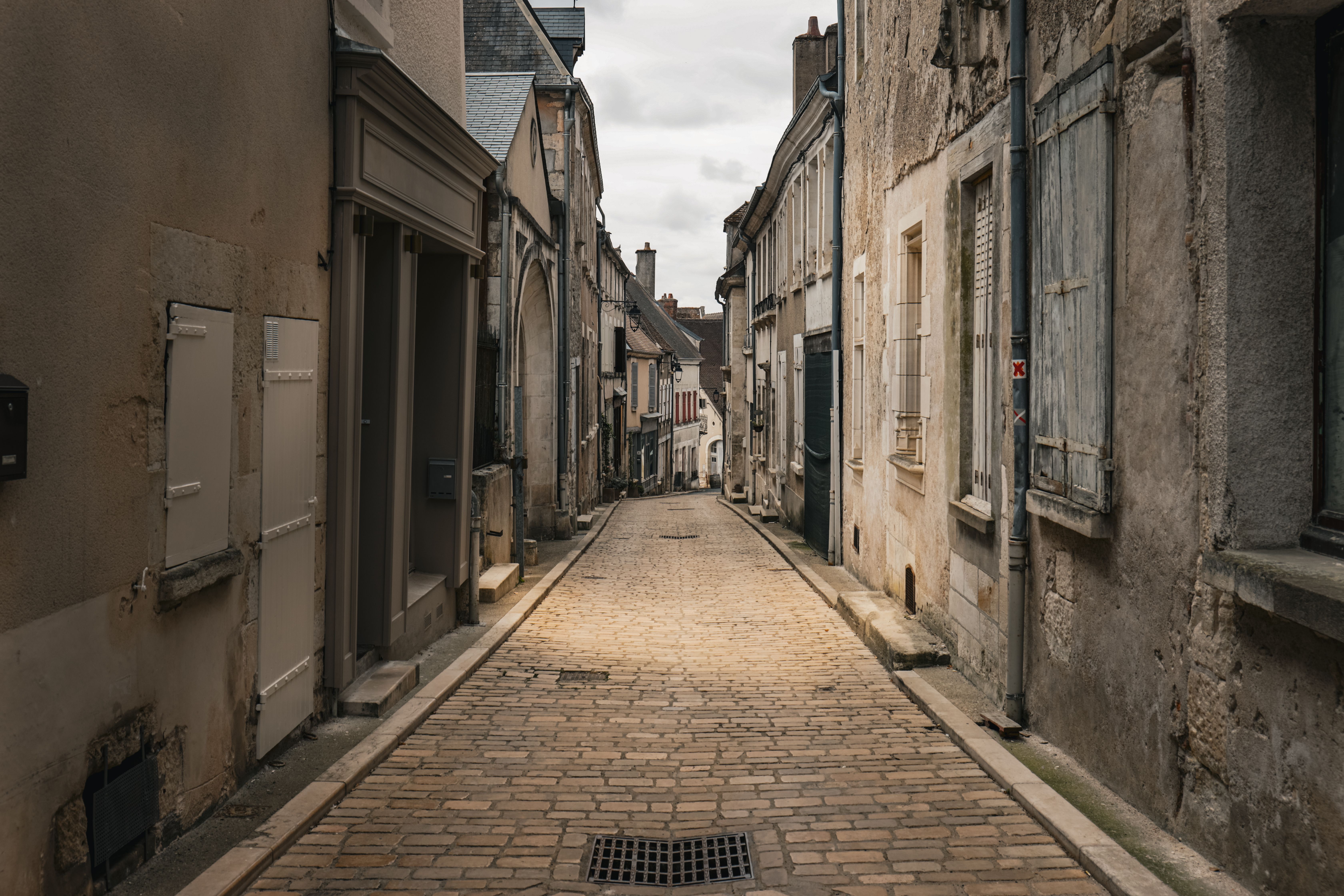 Discover the timeless beauty of Sancerre's cobblestone streets, capturing French charm in every weathered wall.