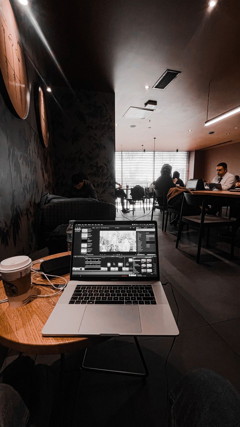 Coffee Computer Visual Workspace Cozy Coffee Shop Workspace with Laptop and Coffee · Free Stock Photo