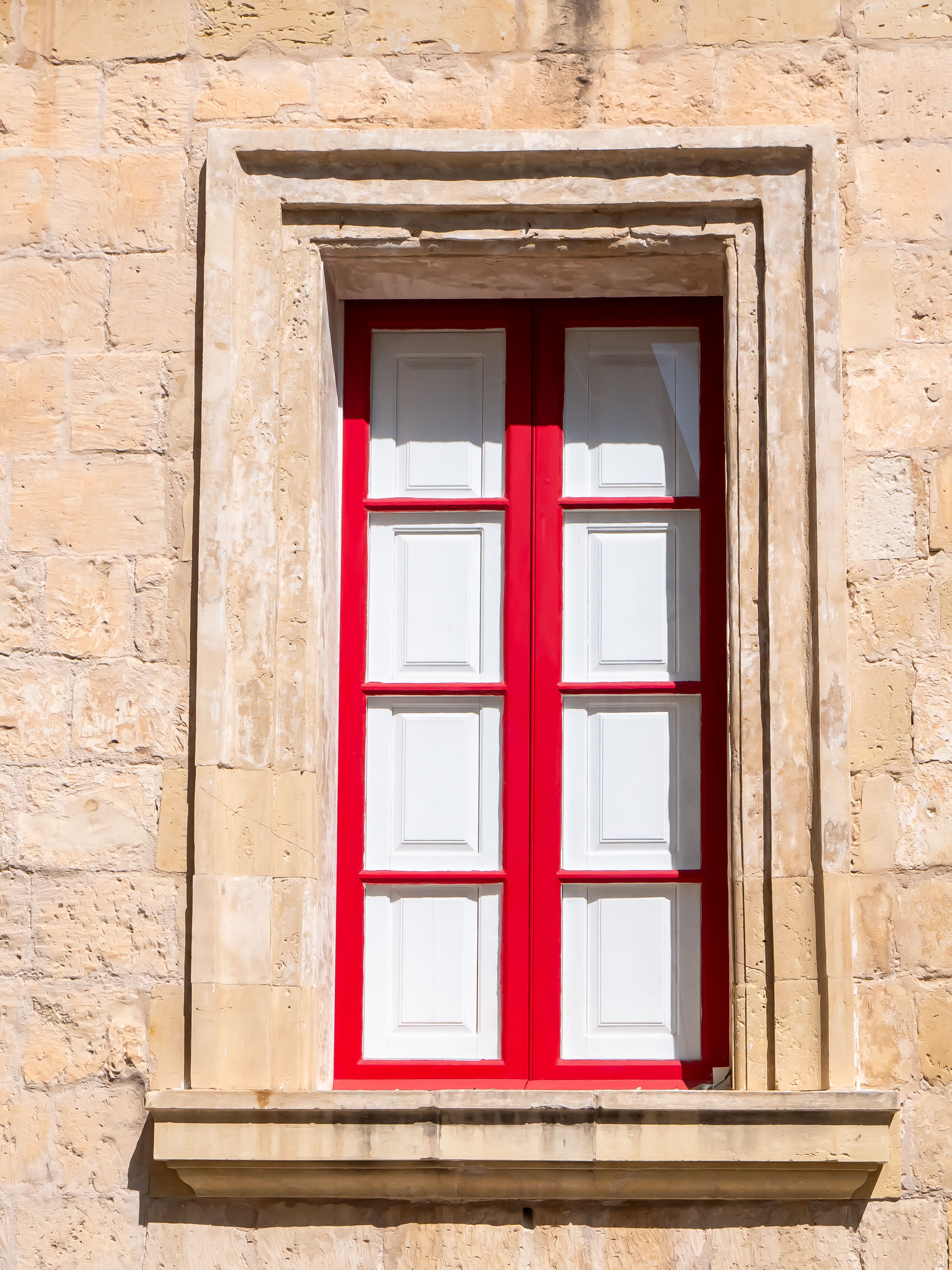 Red and White Shuttered Window on Limestone Wall · Free Stock Photo