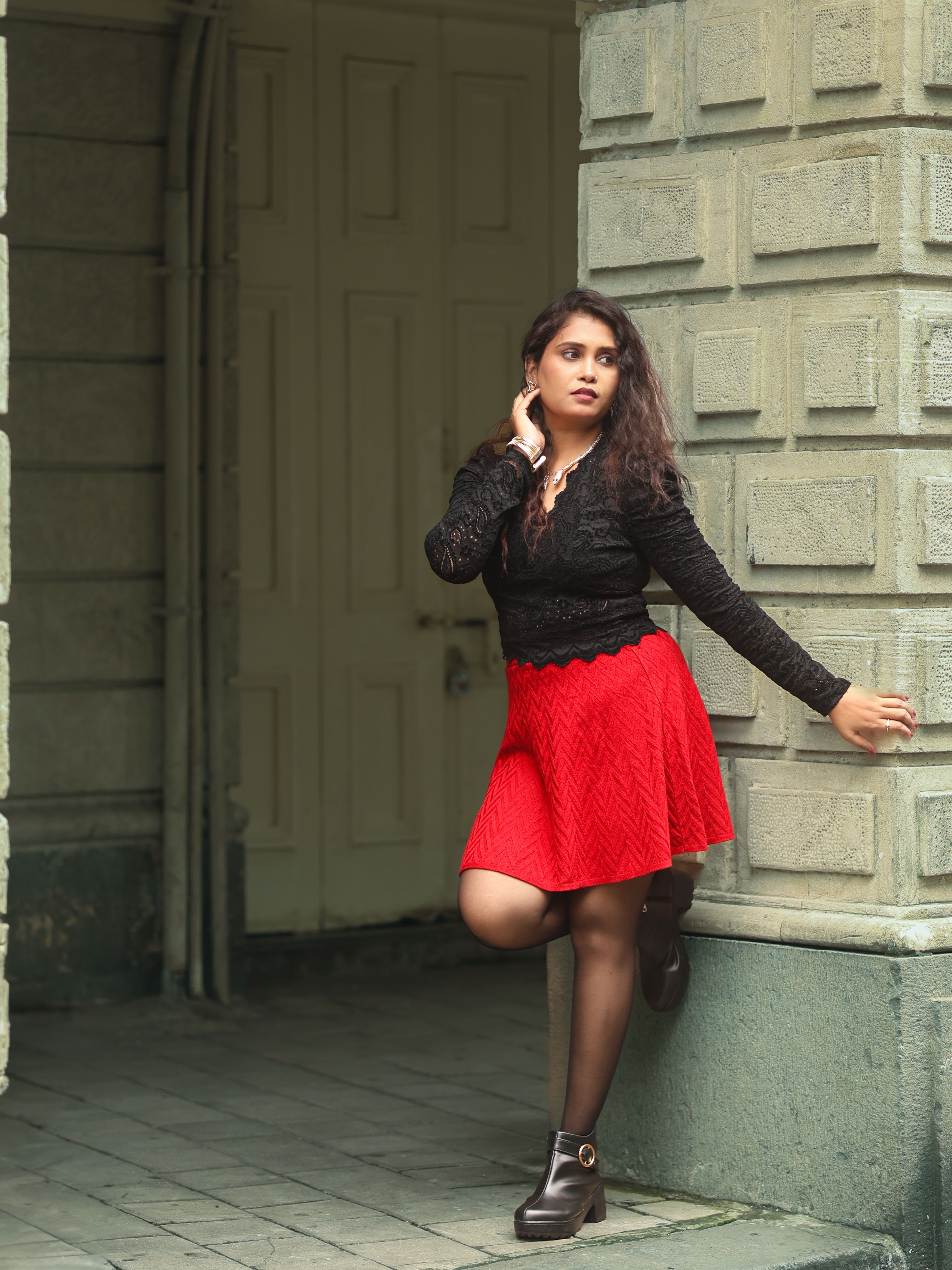 A Fashionable Woman in Red Blouse and Black Skirt · Free Stock Photo