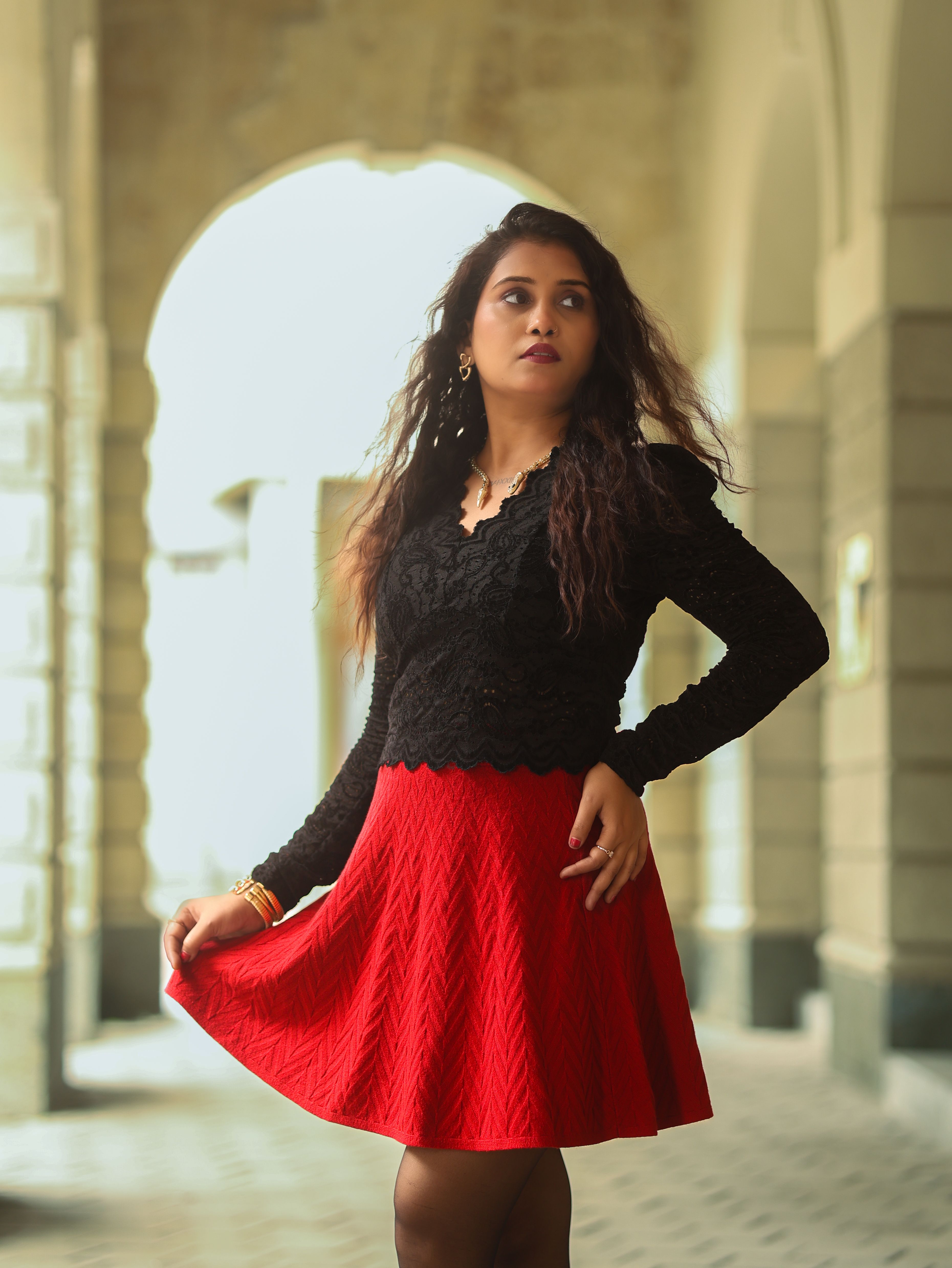 A Fashionable Woman in Red Blouse and Black Skirt · Free Stock Photo