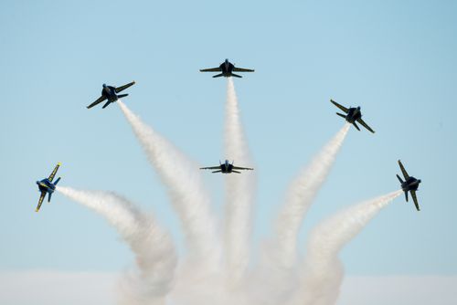 Free The Blue Angels showcase a breathtaking aerial maneuver during an air show in Fairfield, California. Stock Photo