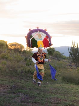 A traditional dancer in vibrant attire performs in the scenic outdoors of Oaxaca de Juárez at dawn.
