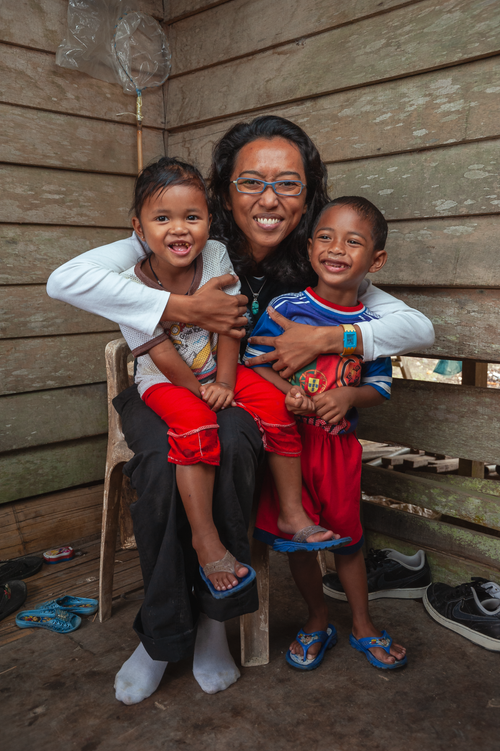Free A joyful family moment captured indoors in Cameron Highlands, Malaysia. Stock Photo