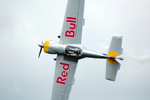 Gray Red Bull Monoplane on Mid Air