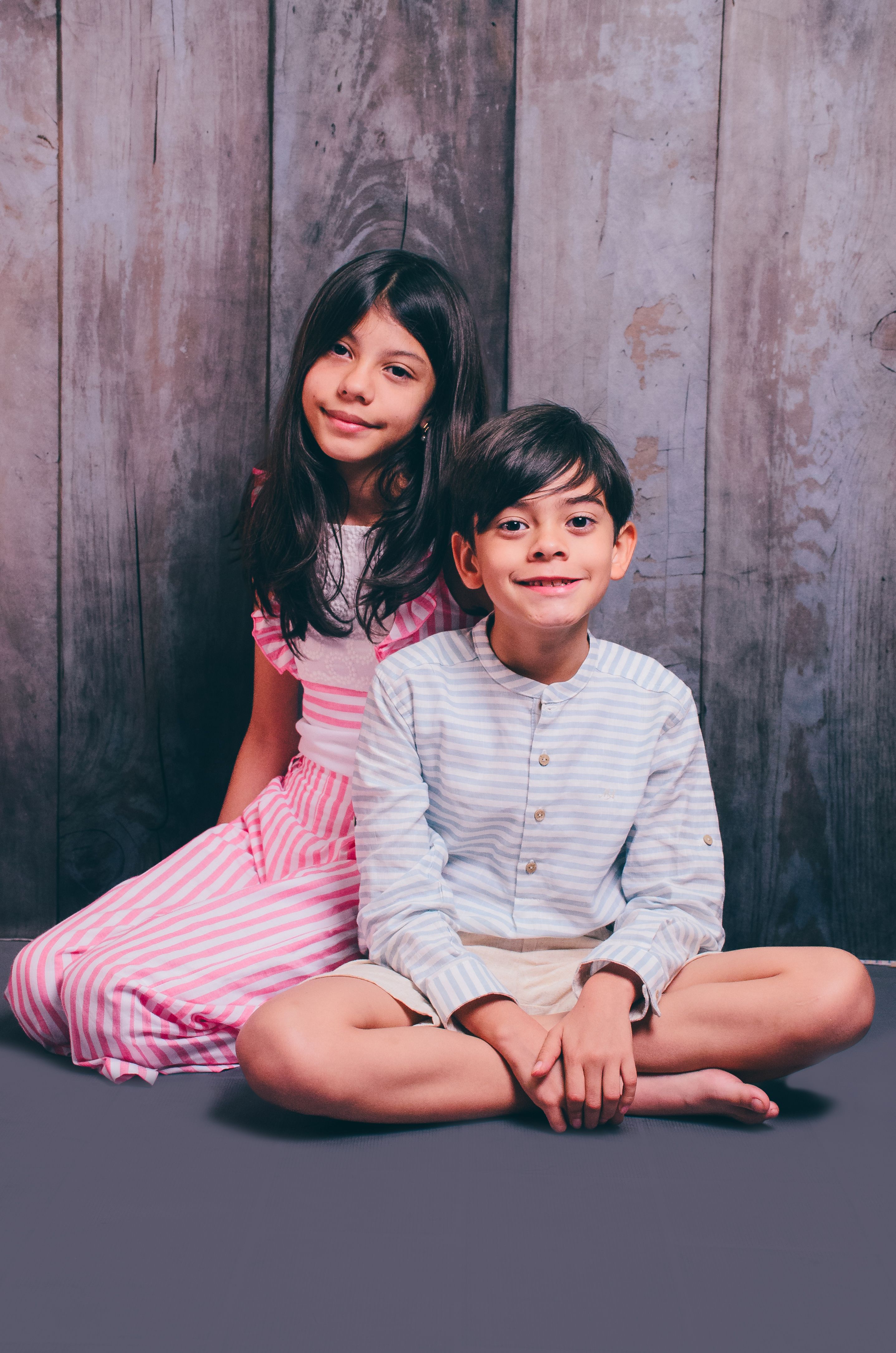 Charming Portrait of Two Children in Rustic Setting · Free Stock Photo
