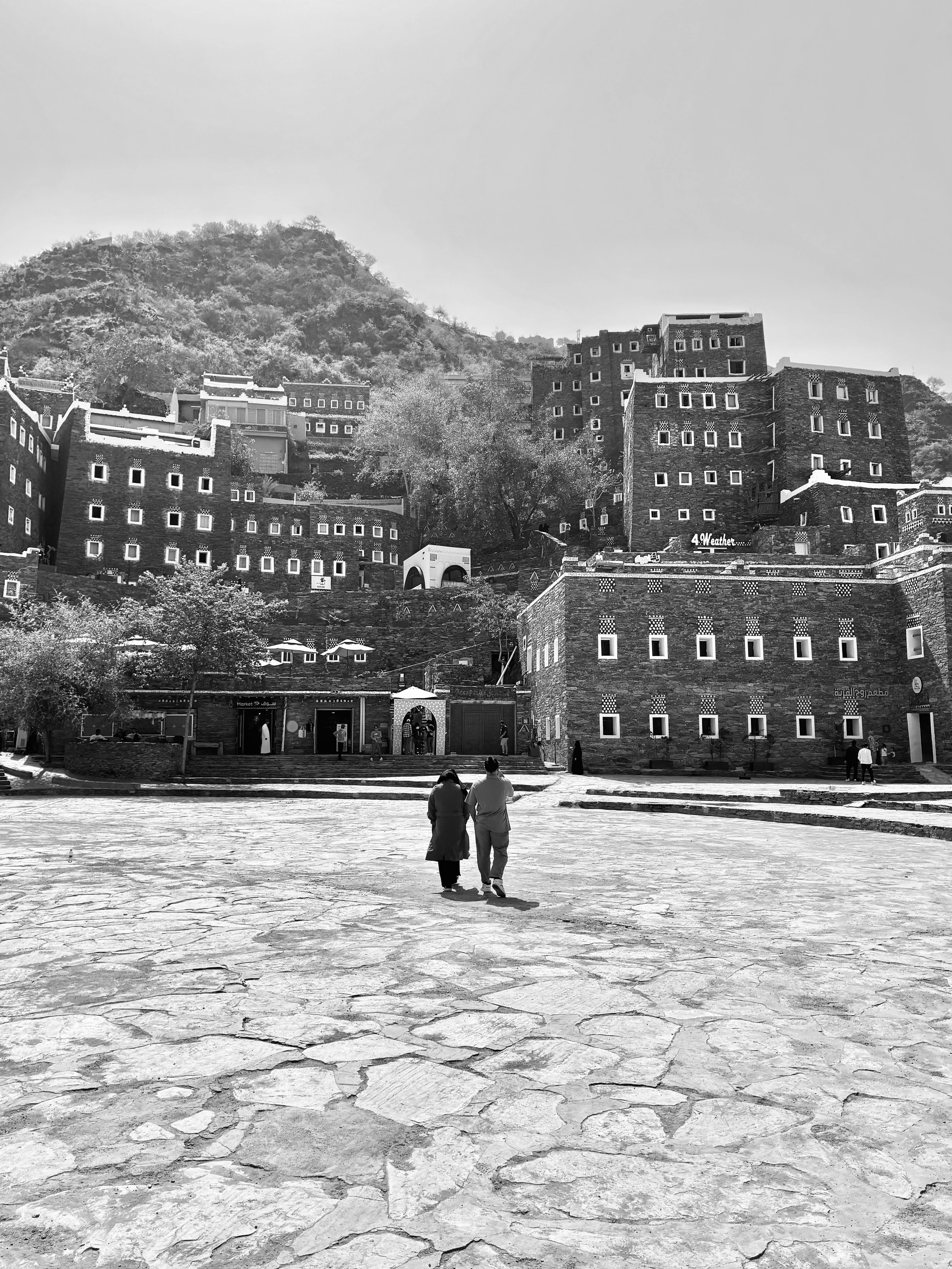 Black and white photo of traditional buildings in Abha, Saudi Arabia.