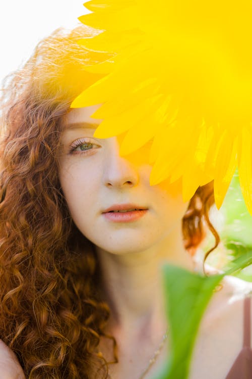 Free Woman Behind Yellow Flower Stock Photo