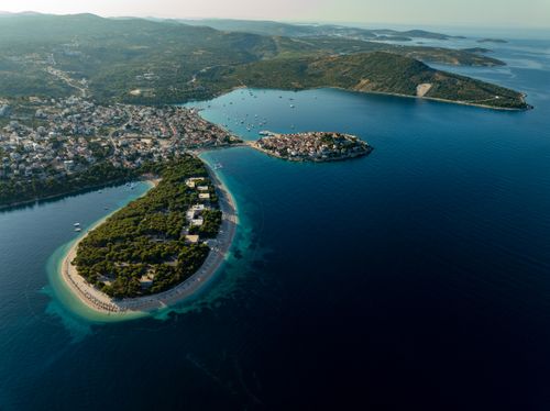 Free Discover the stunning aerial view of Primošten, Croatia, showcasing its coastal landscape and clear blue waters. Stock Photo