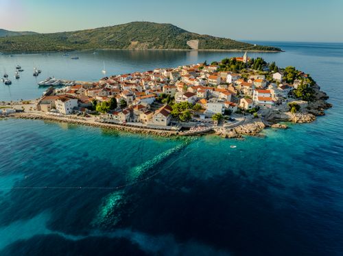 Free Stunning aerial shot of Primošten, Croatia showcasing its coastal beauty and clear turquoise waters. Stock Photo