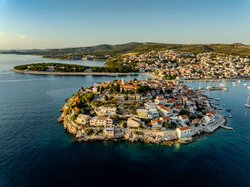 Free Stunning aerial view of Primošten peninsula and azure sea from above. Stock Photo