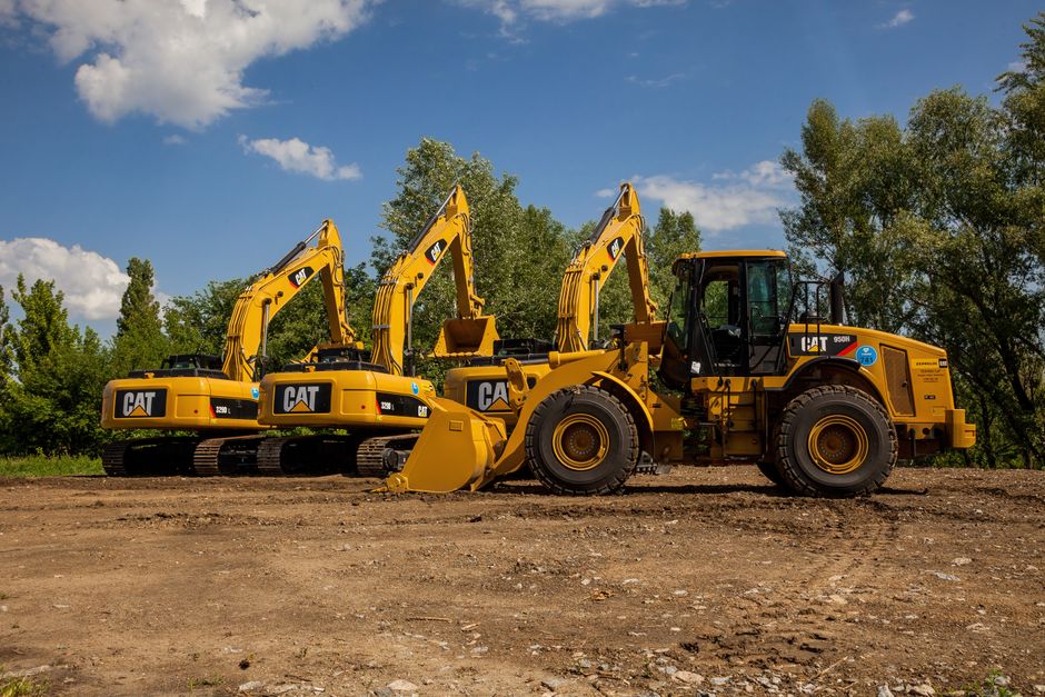 Caterpillar Inc. (CAT): The 100-Year-Old Industrial Giant Quietly Becoming an AI-Infrastructure Power Play 1 Four yellow excavators at an outdoor construction site in Kyiv, Ukraine.
