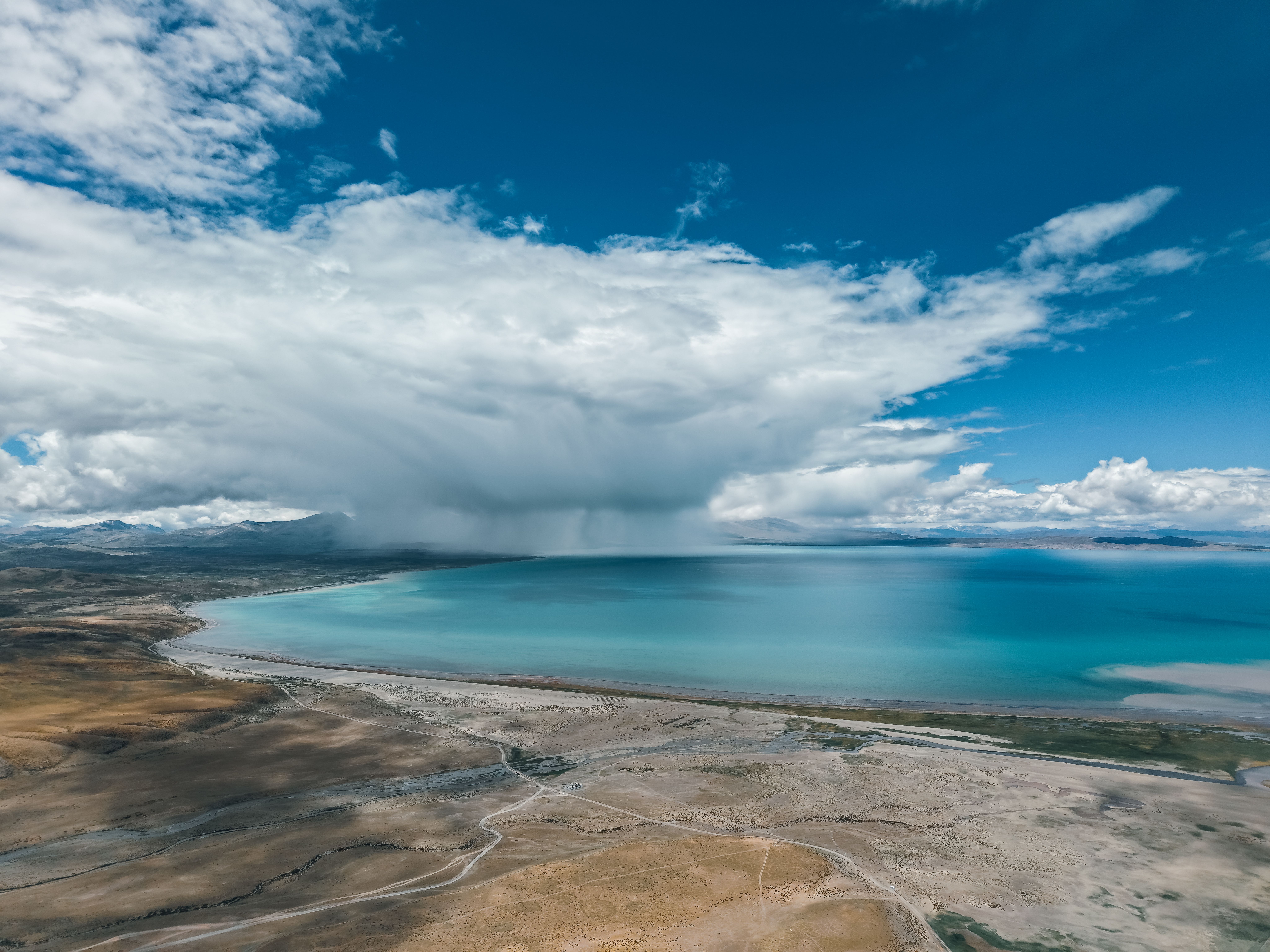 Aerial View of Storm Over Serene Lake Landscape · Free Stock Photo