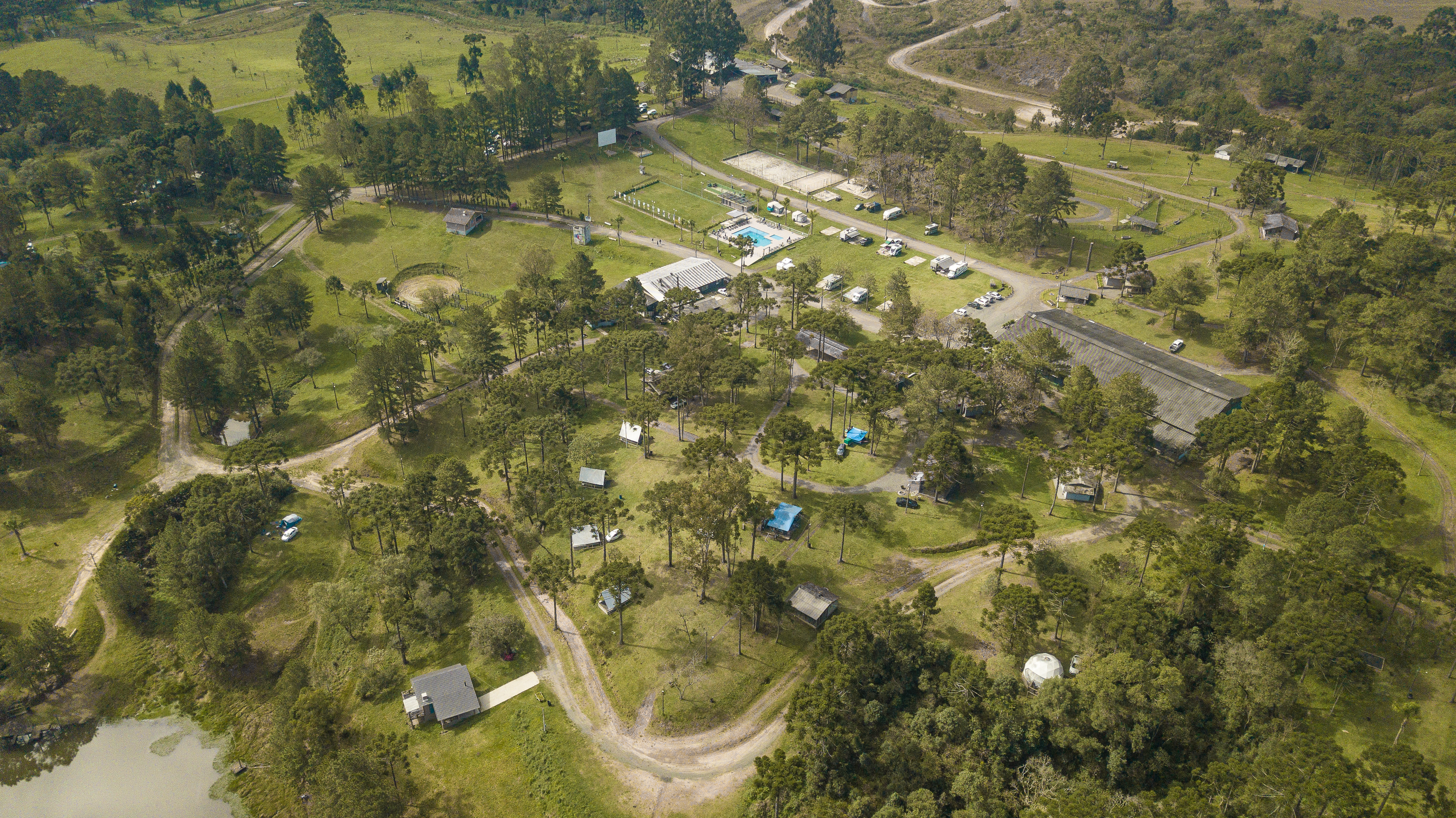 Aerial view of a tidy cabin park near the coast