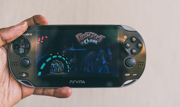 Close-up of a hand holding a PlayStation Vita with Ratchet & Clank displayed on screen. Captured in Johannesburg.