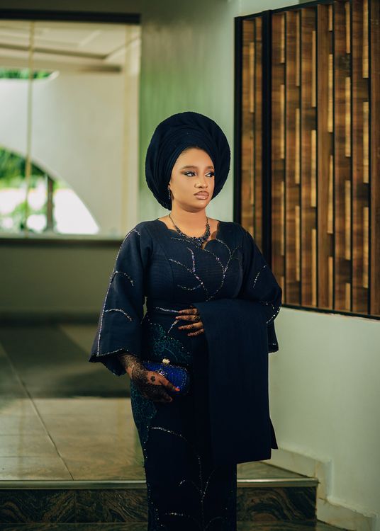 Elegant Woman in Traditional African Dress Indoors · Free Stock Photo