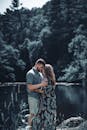 Romantic Couple Embracing by Forest Lake