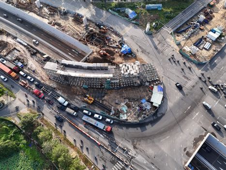 An aerial shot of a busy construction site and traffic in Ho Chi Minh City, Vietnam.