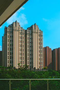 Tall skyscrapers against a clear blue sky, showcasing urban architecture.