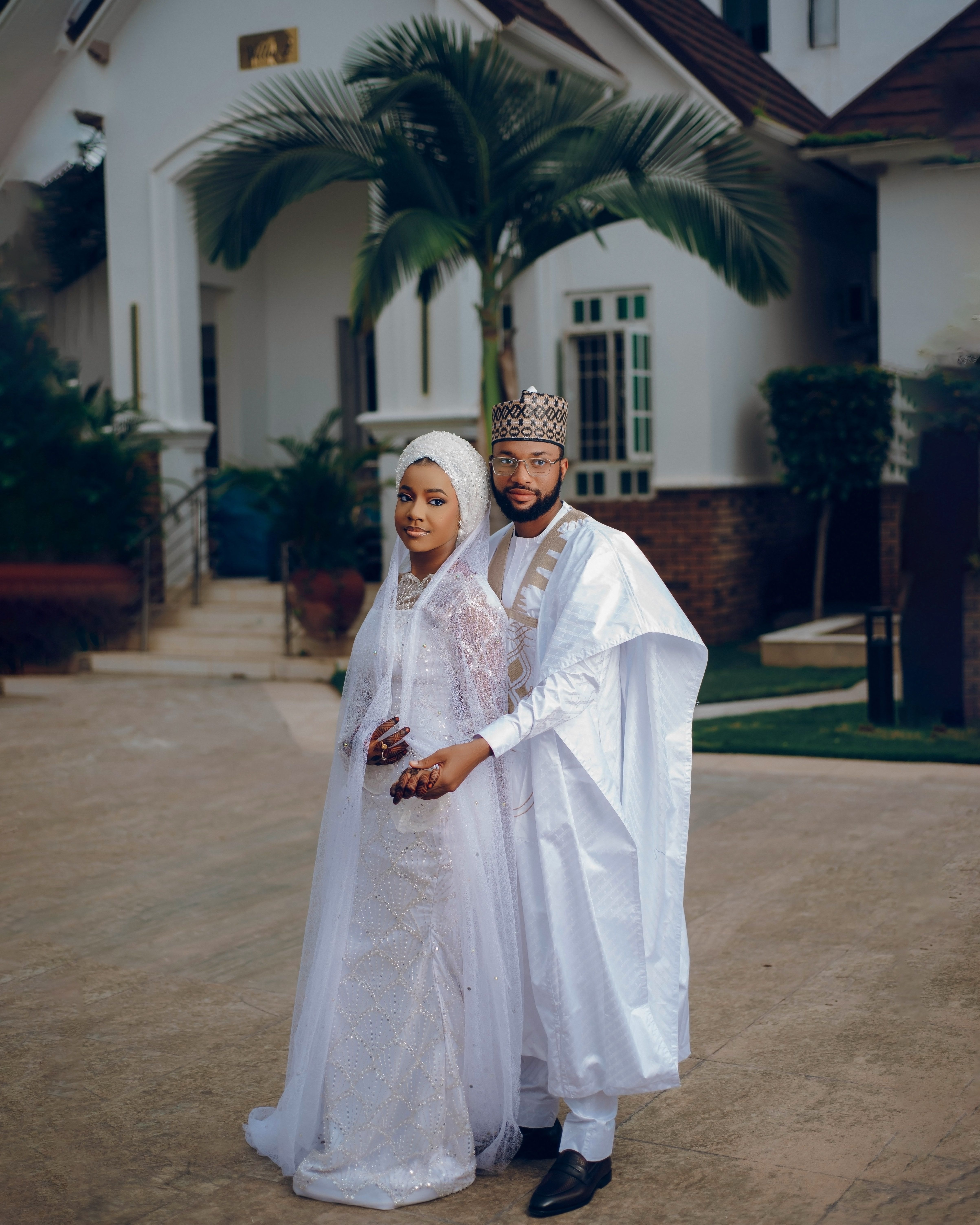 Elegant Couple in Traditional Wedding Attire Outdoors · Free Stock Photo