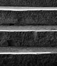 Close-up of Textured Stone Steps in Black and White