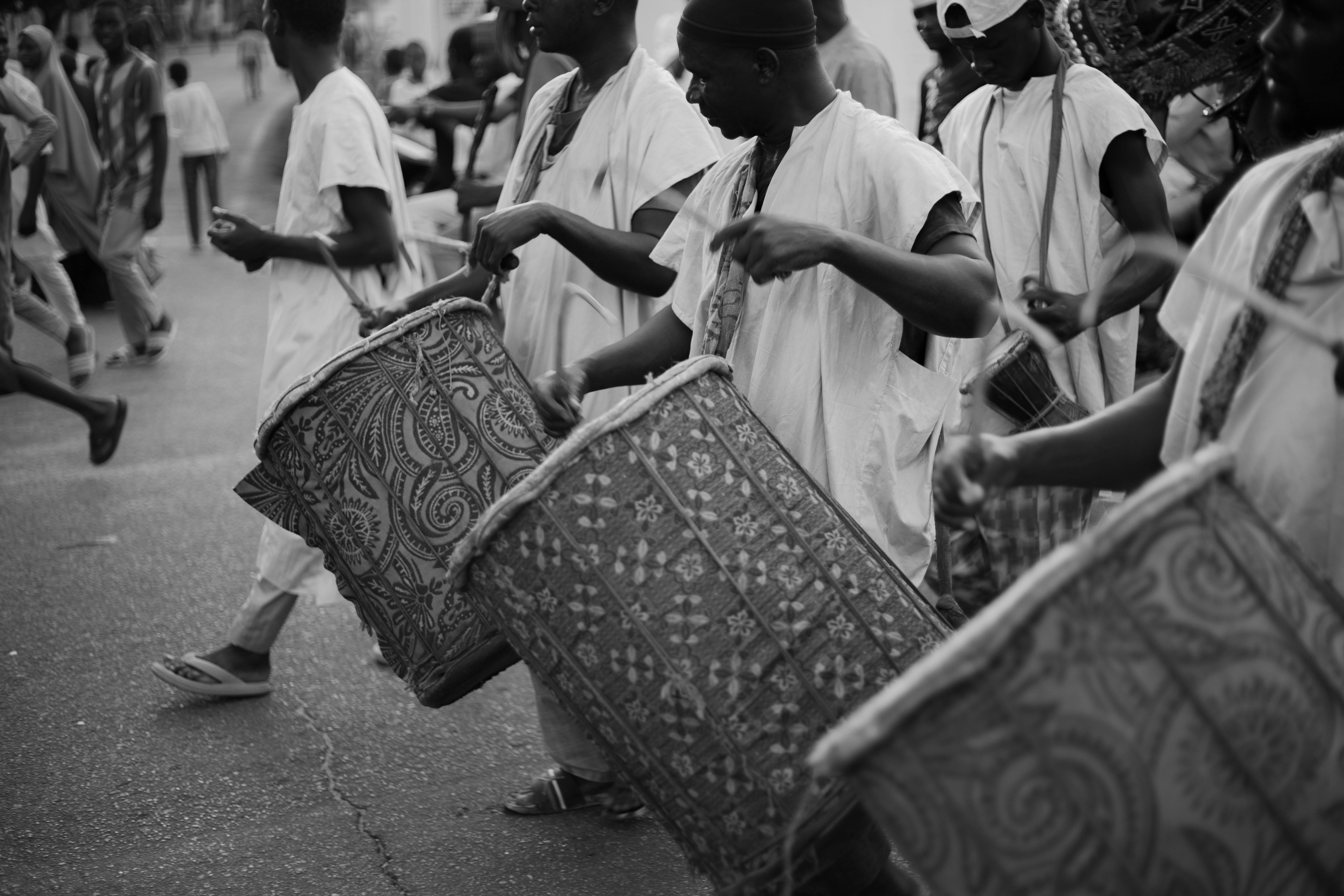 Ewe drumming group performing in traditional attire at a cultural festival in Ho Volta Region