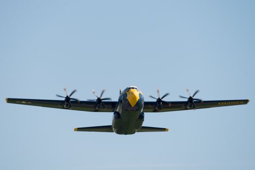 C-130 Hercules military aircraft in flight at a Fairfield air show in California.