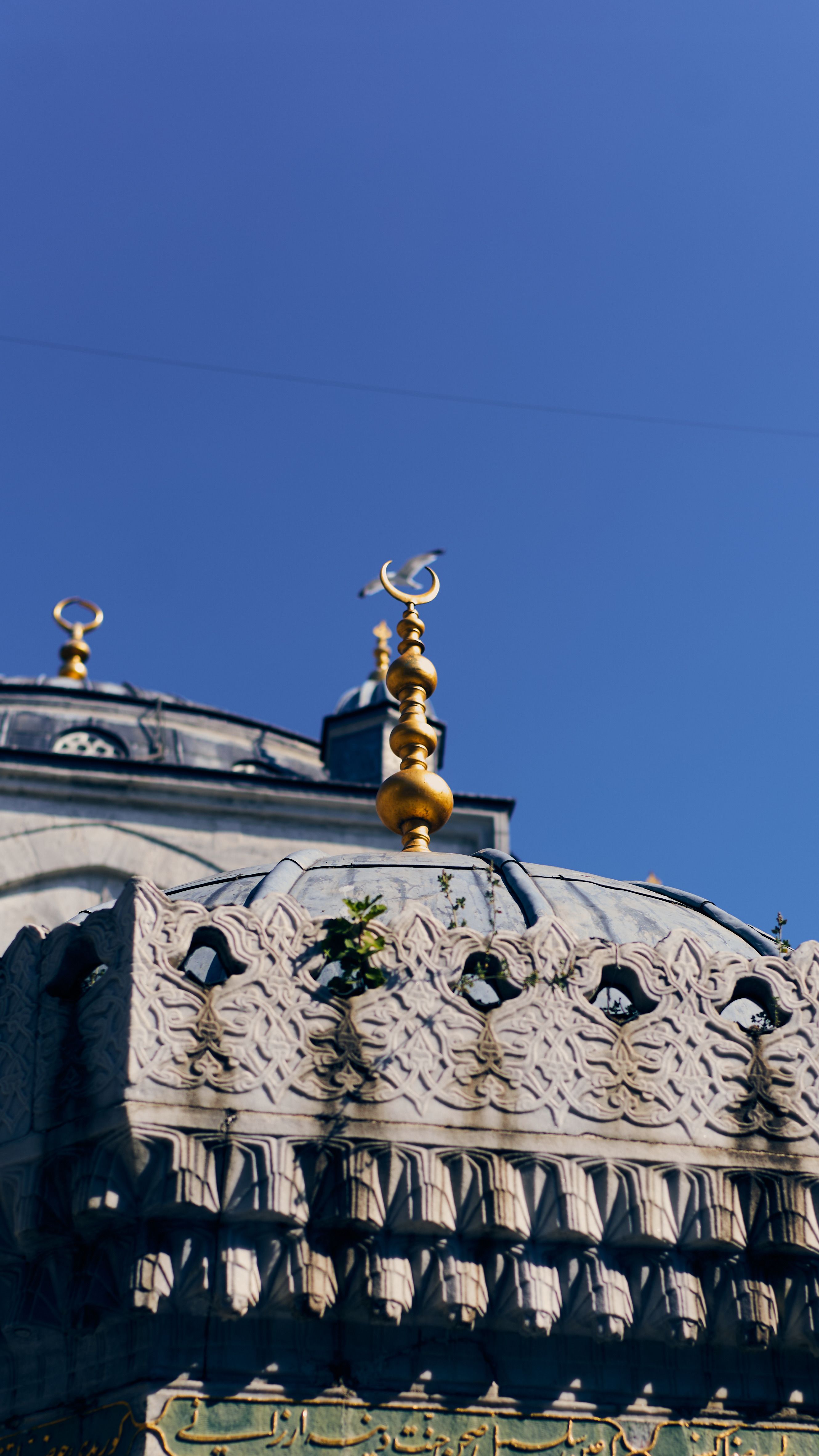 Ornate Mosque Dome Against Clear Blue Sky · Free Stock Photo