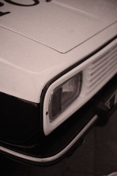 Free Close-up of a vintage car's headlight in sepia tone, evoking classic nostalgia. Stock Photo