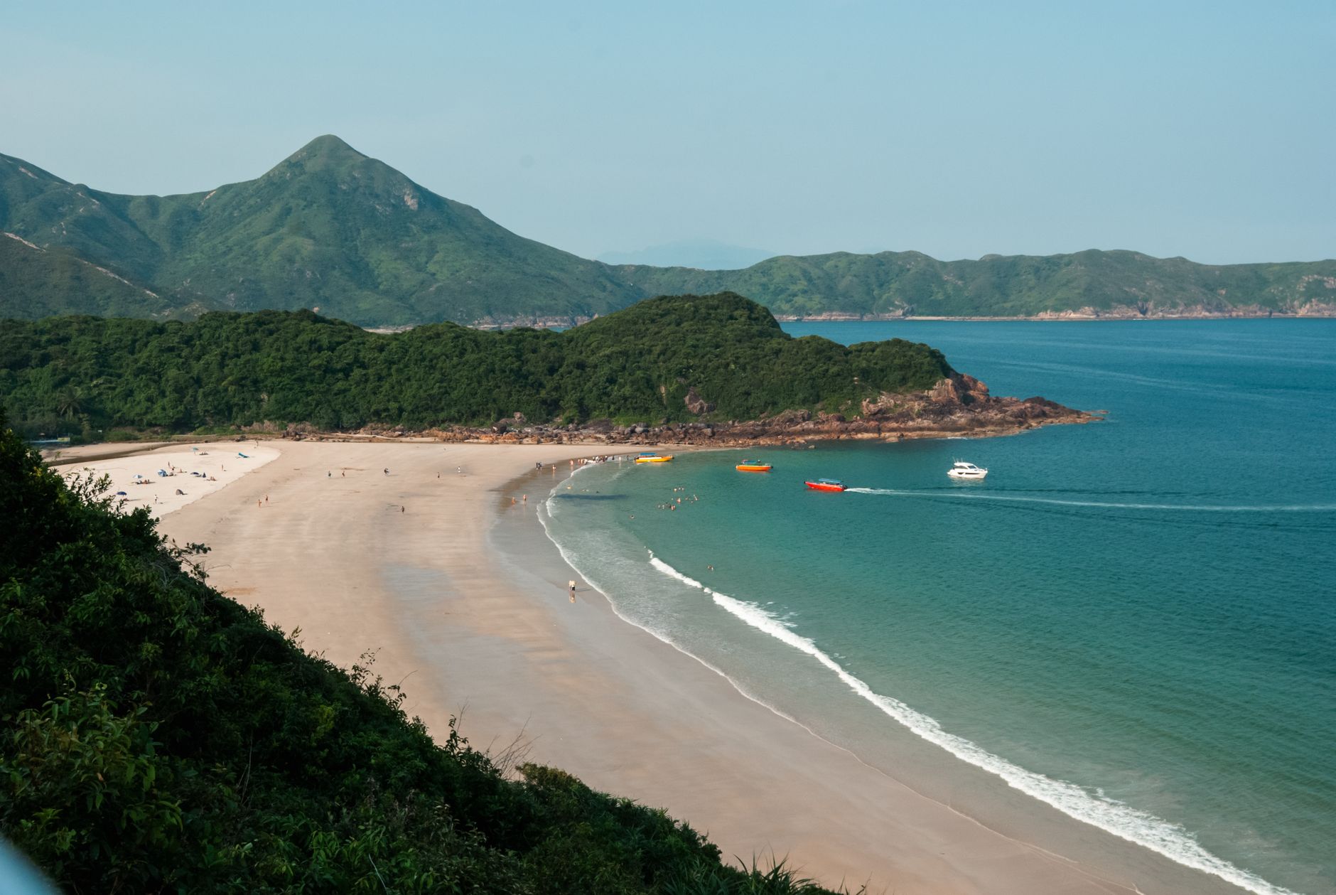 Kayaking through the sea caves of Sai Kung at dawn to spot bioluminescent plankton