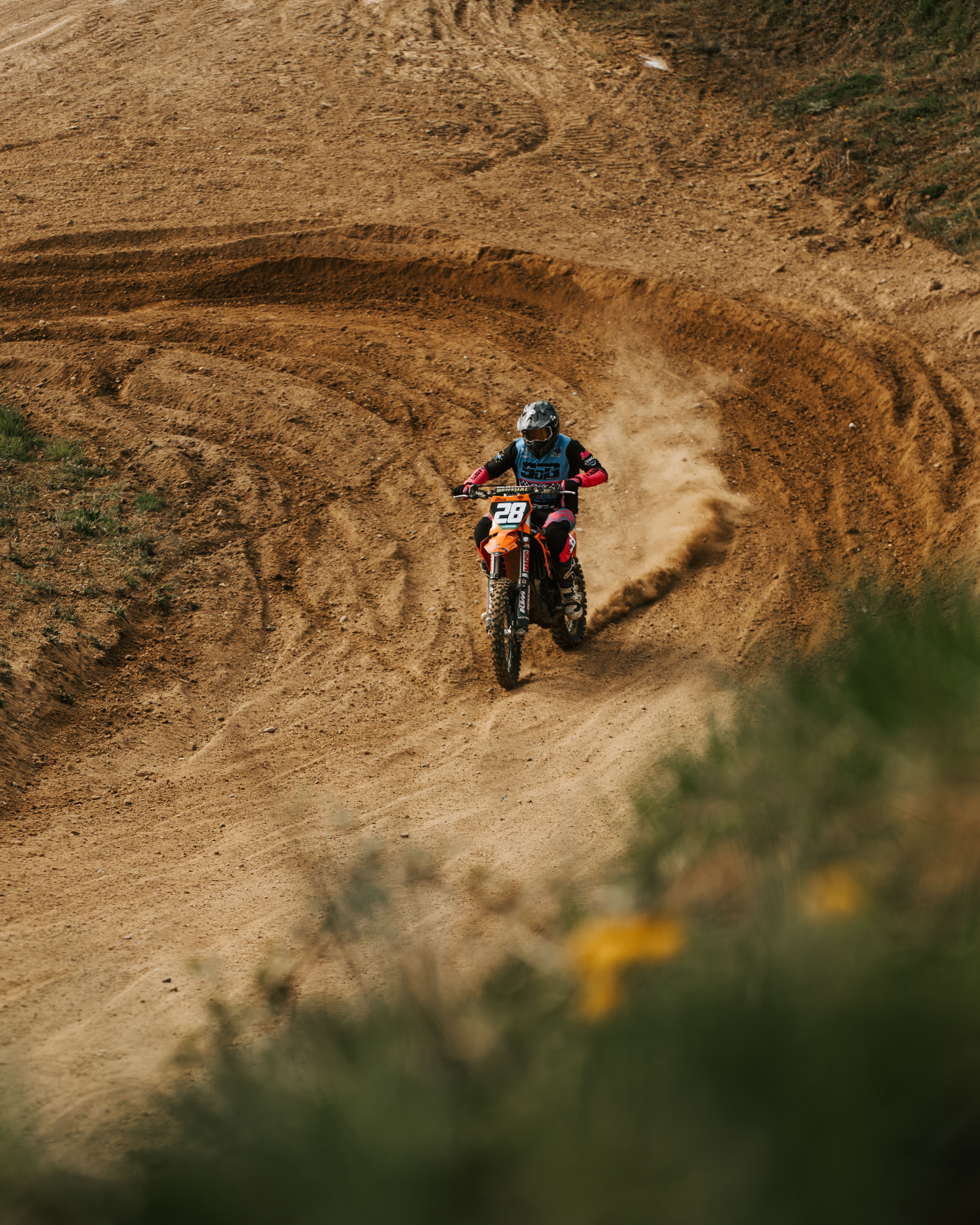 Dynamic Motocross Rider on a Dirt Track in Action · Free Stock Photo