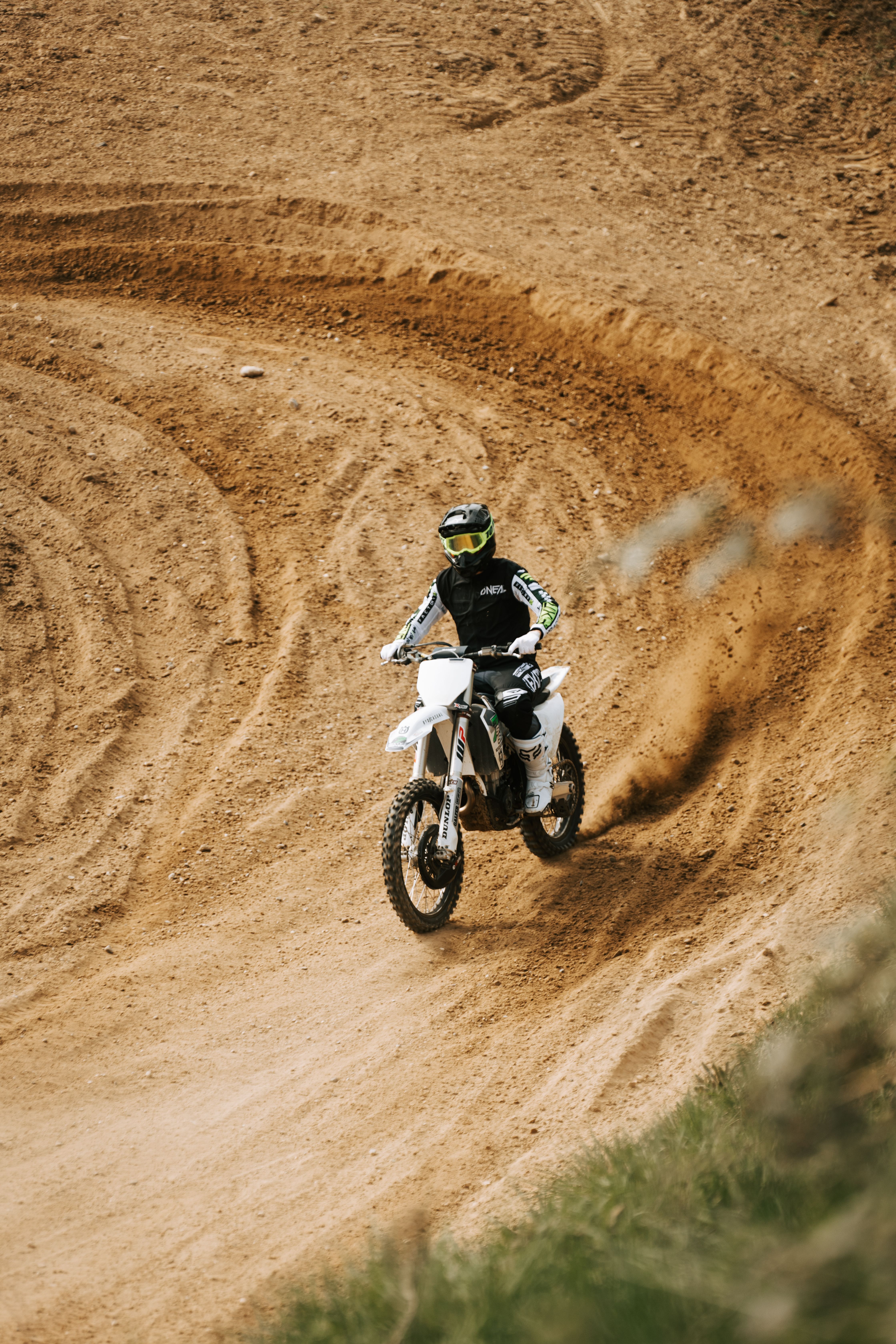Dynamic Motocross Rider on a Dirt Track in Germany · Free Stock Photo