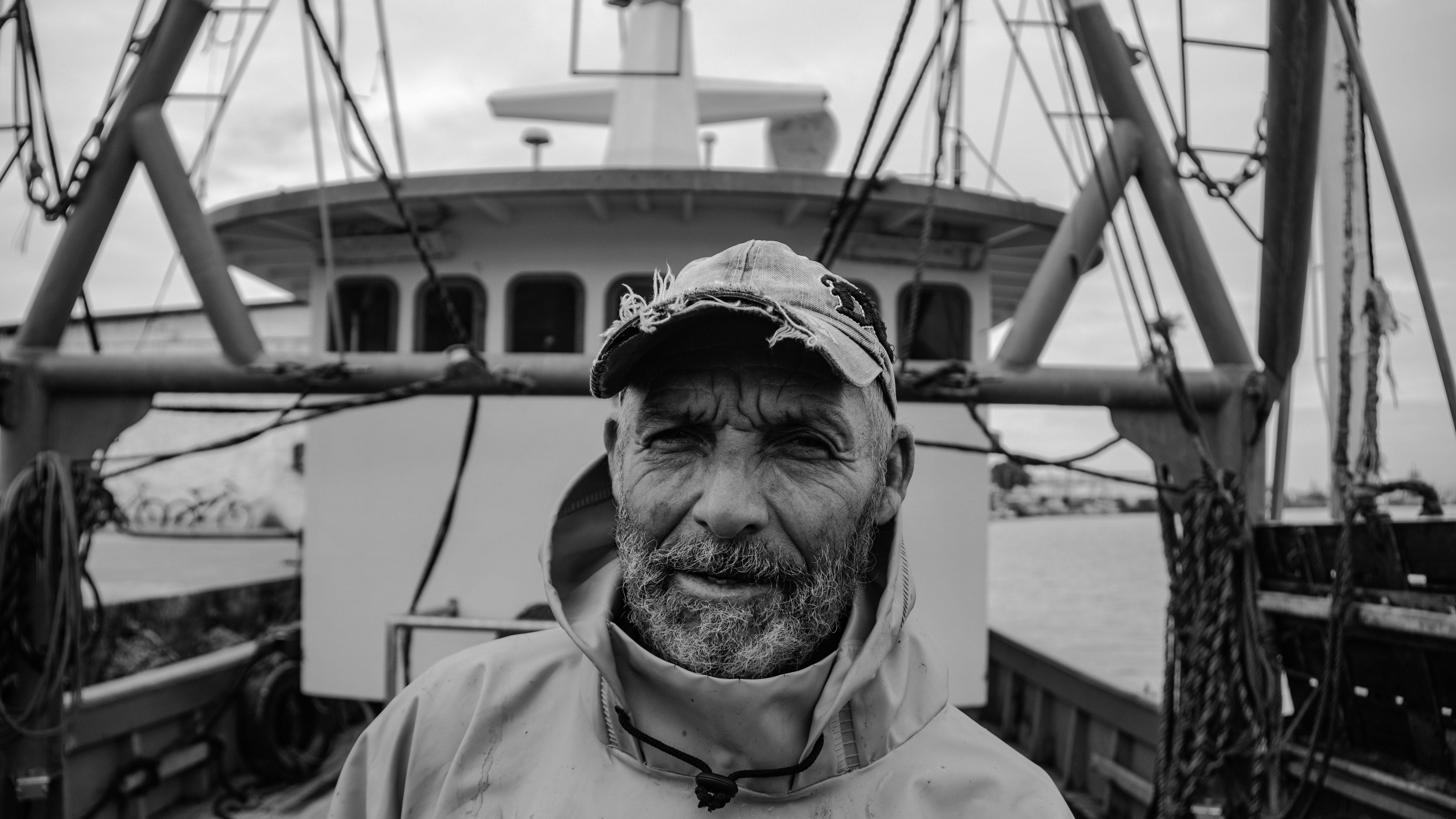 Black and White Portrait of a Fisherman on a Boat · Free Stock Photo
