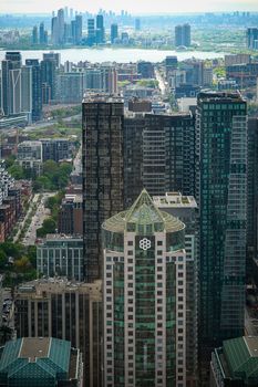 Stunning aerial view of Toronto's modern skyline with skyscrapers and lake in the background.