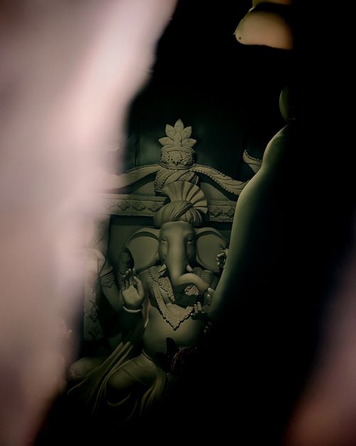 Free A close-up view of an intricate Ganesha idol in a Kolkata workshop, showcasing fine craftsmanship. Stock Photo