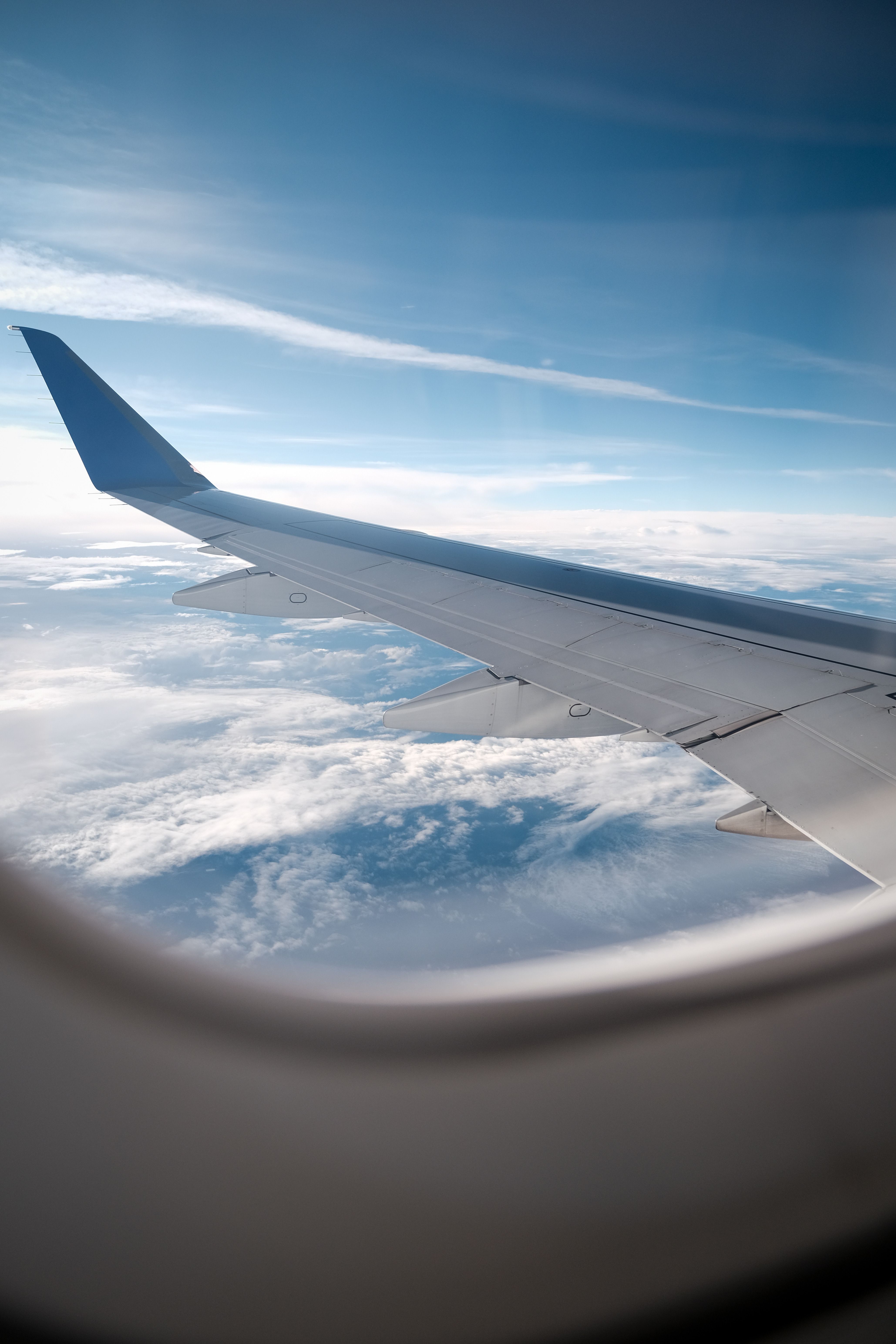 Aerial View from Airplane Window on Sunny Day · Free Stock Photo