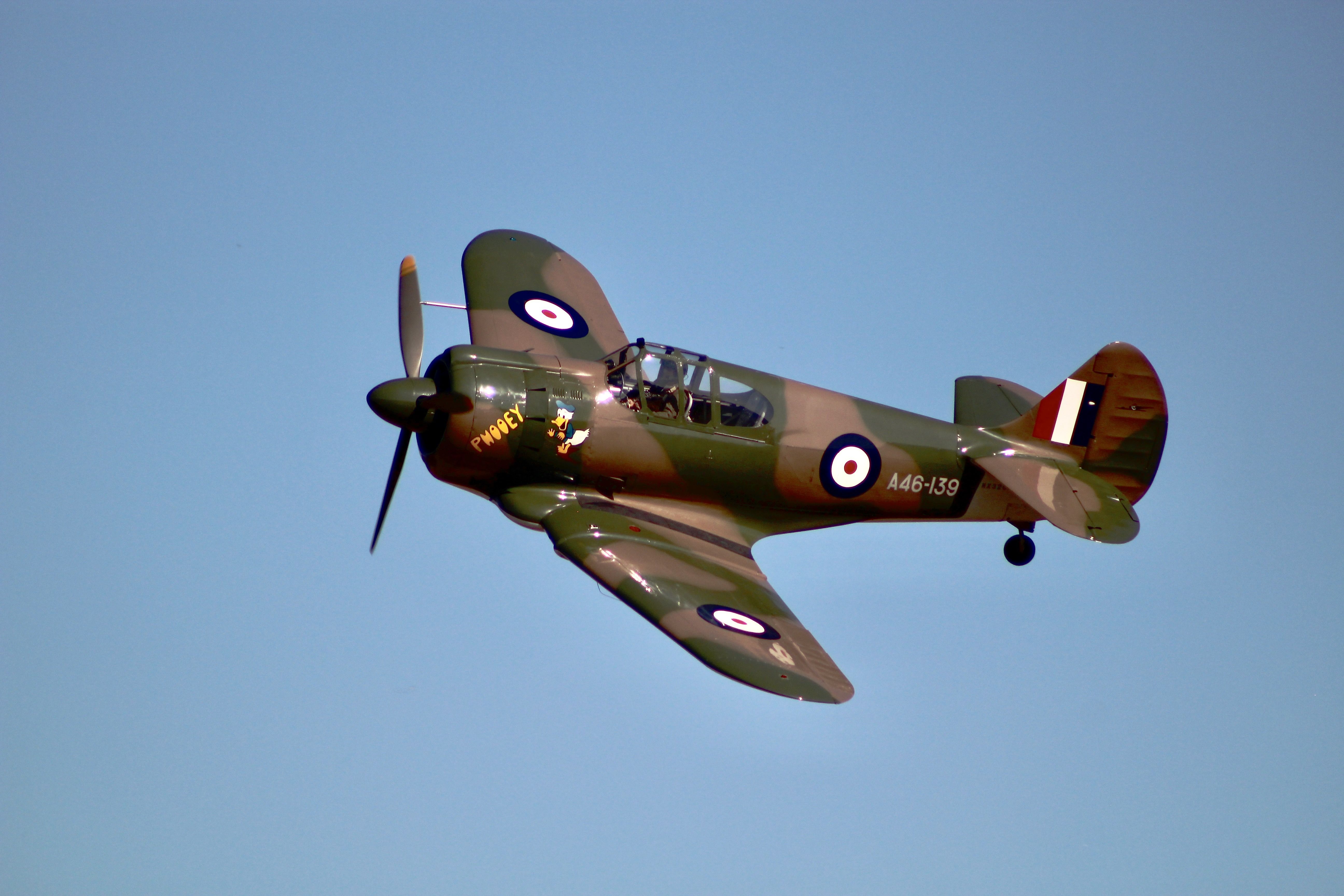 Vintage Fighter Plane Soaring in Clear Skies · Free Stock Photo