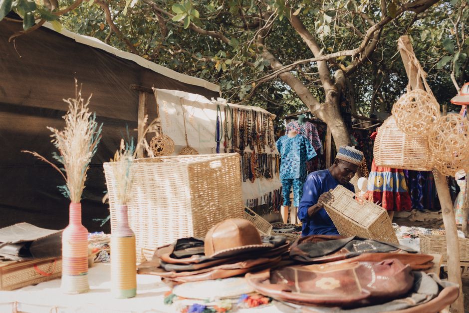 Traditional beaded jewelry and wooden carvings at an African craft market in Johannesburg, South Africa