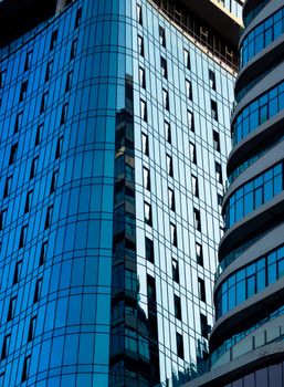 Contemporary architectural design of a glass skyscraper in Tbilisi, reflecting urban elegance.