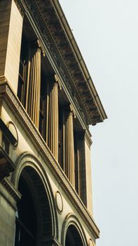 Classical architecture featuring arched windows and detailed columns.