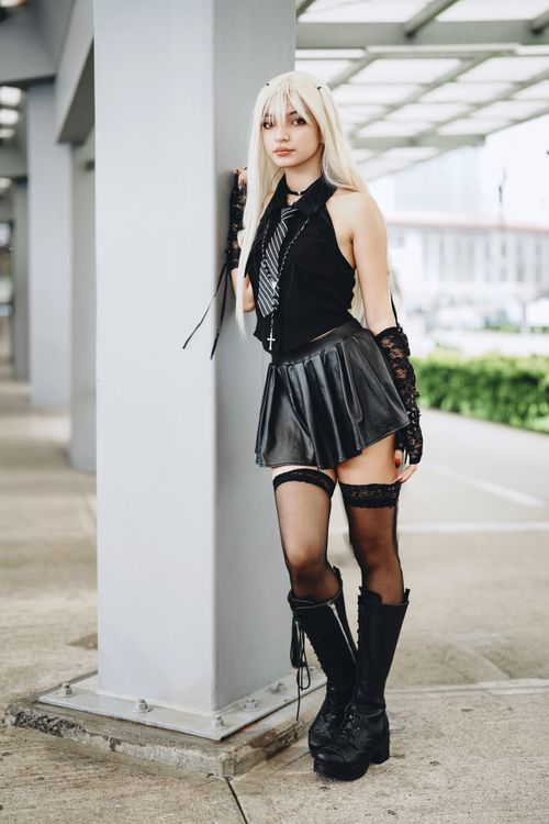Free A young woman in gothic cosplay poses outdoors in an urban setting in San José. Stock Photo