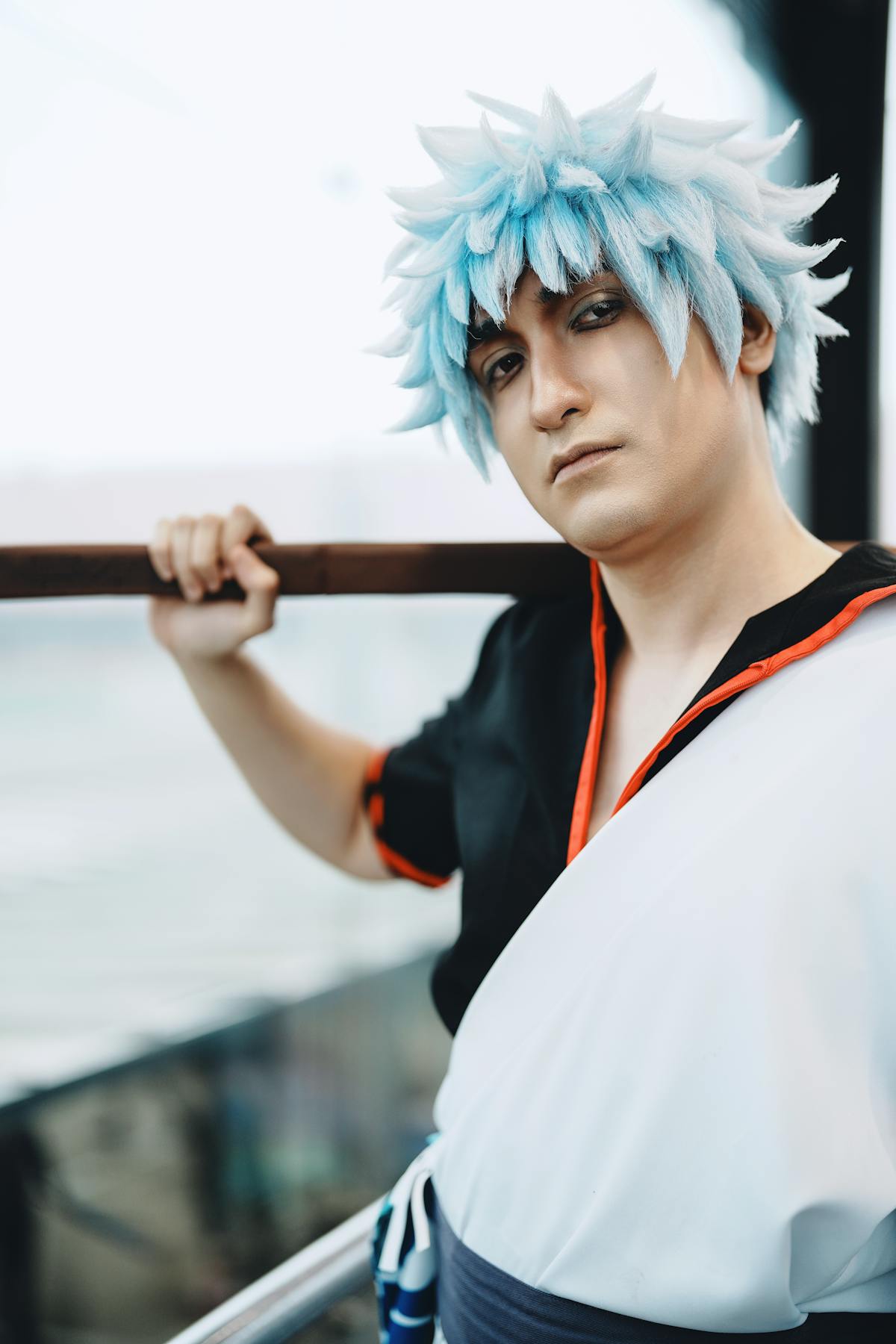 Anime cosplayer with blue wig at a convention