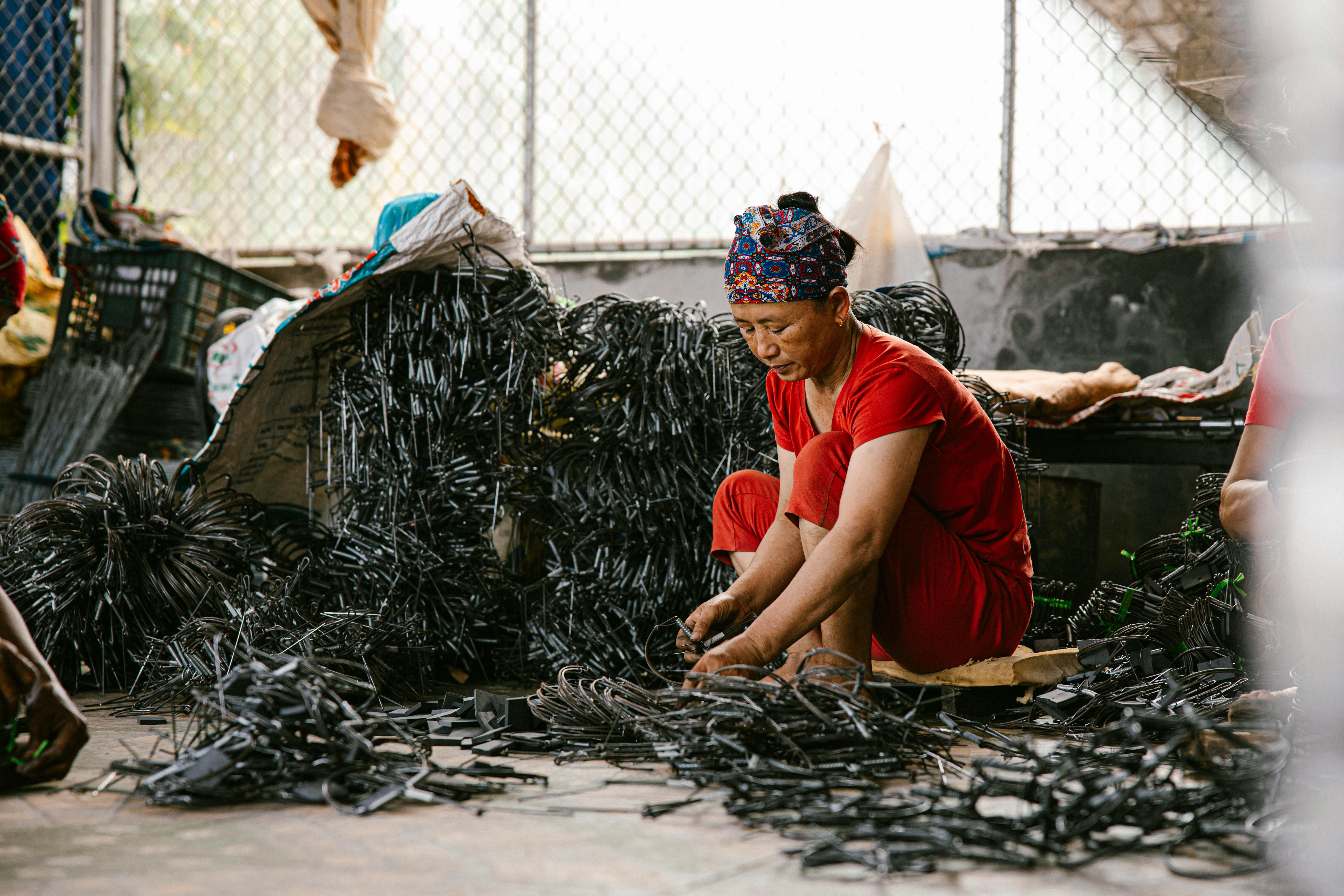 An AI robot sorting and categorizing different types of waste materials in a recycling facility.