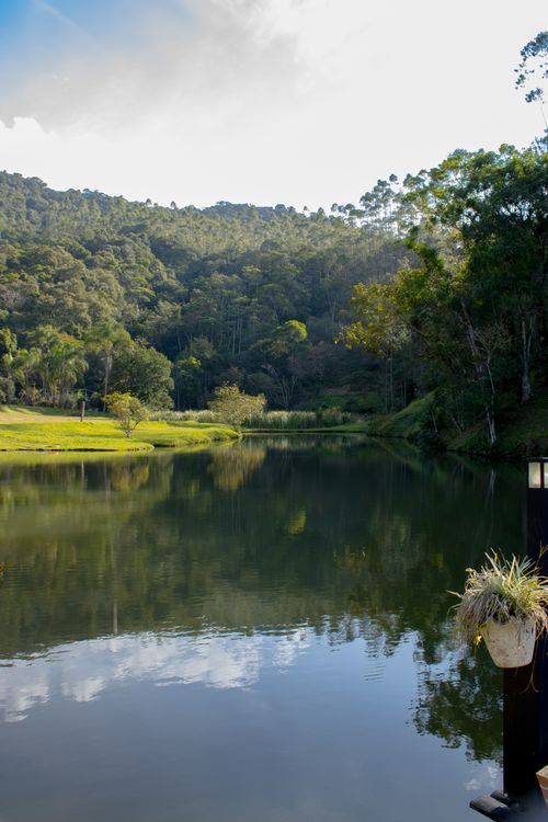 Free Peaceful lake surrounded by forest in Gaspar, Santa Catarina, Brazil, perfect nature retreat. Stock Photo