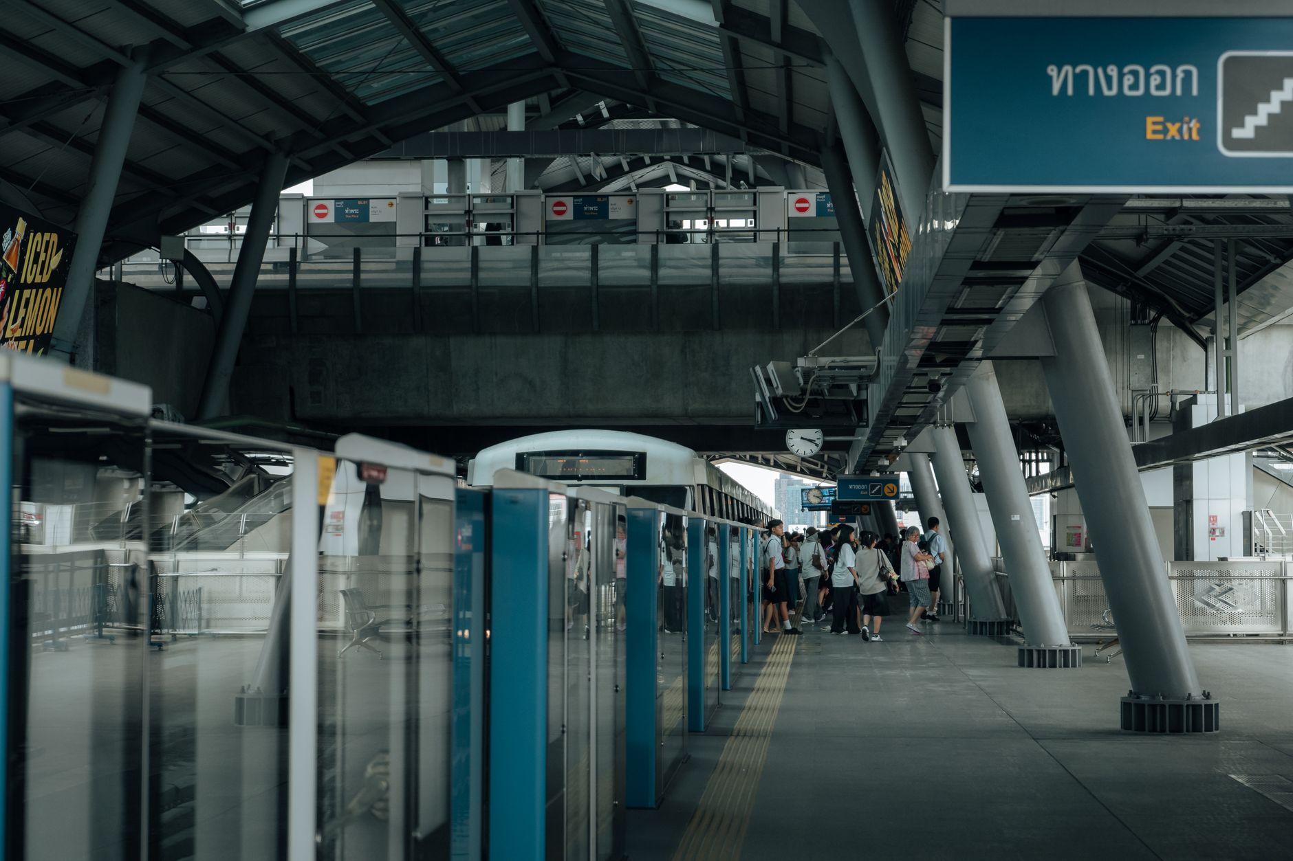 BTS Skytrain arriving at an elevated Bangkok station