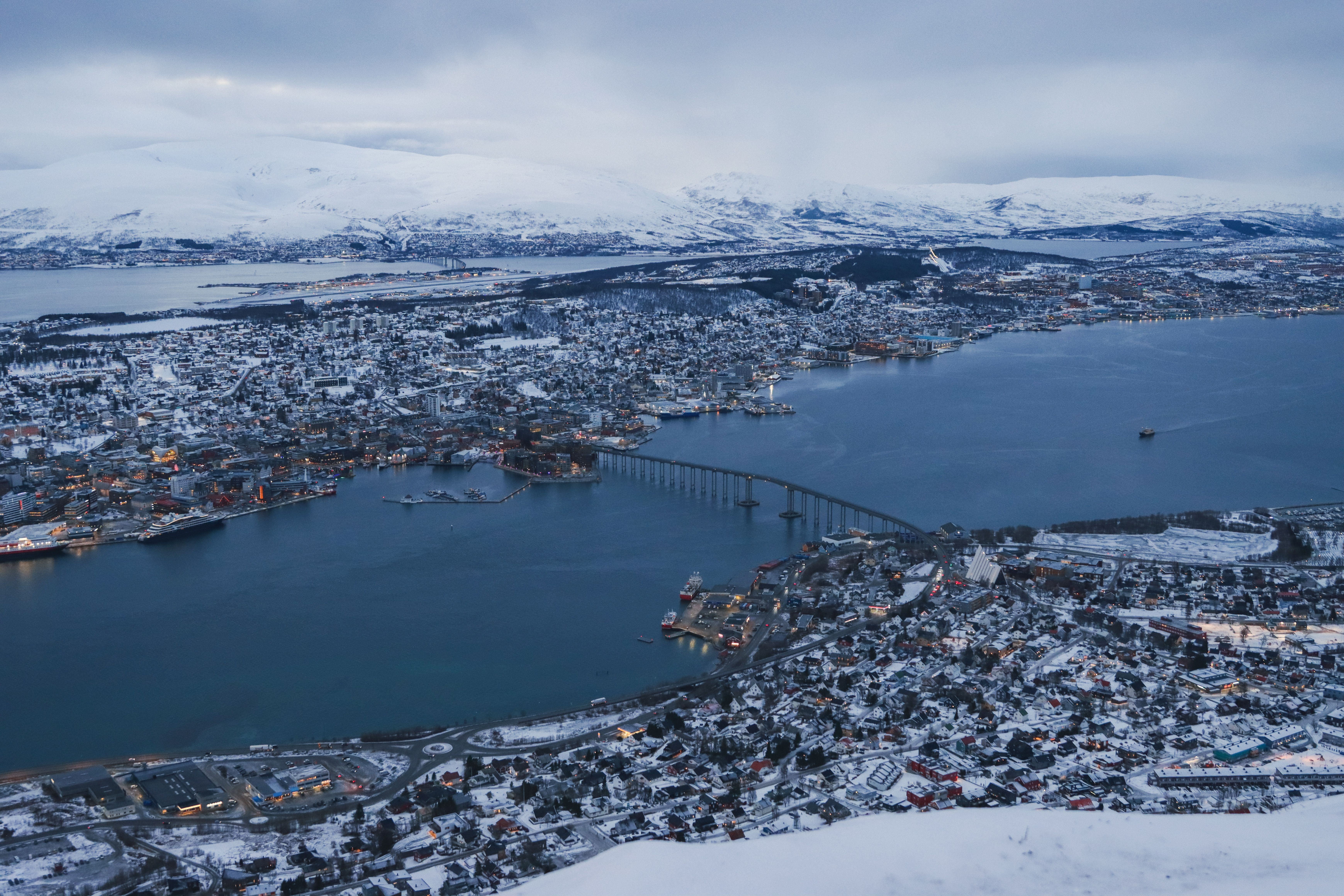 Breathtaking aerial view of snow-covered Tromsø in winter, Norway with fjords and mountains. - Tromsø