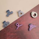Colorful Hair Clips on Textured Background