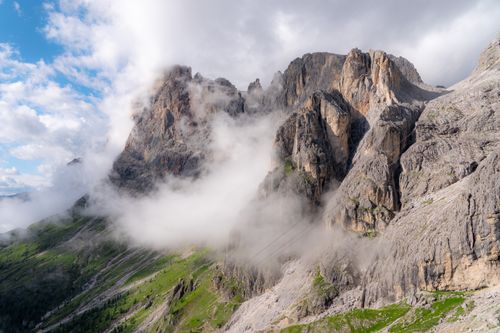 Free Stunning view of the Dolomites with clouds enveloping the rugged mountain peaks. Stock Photo